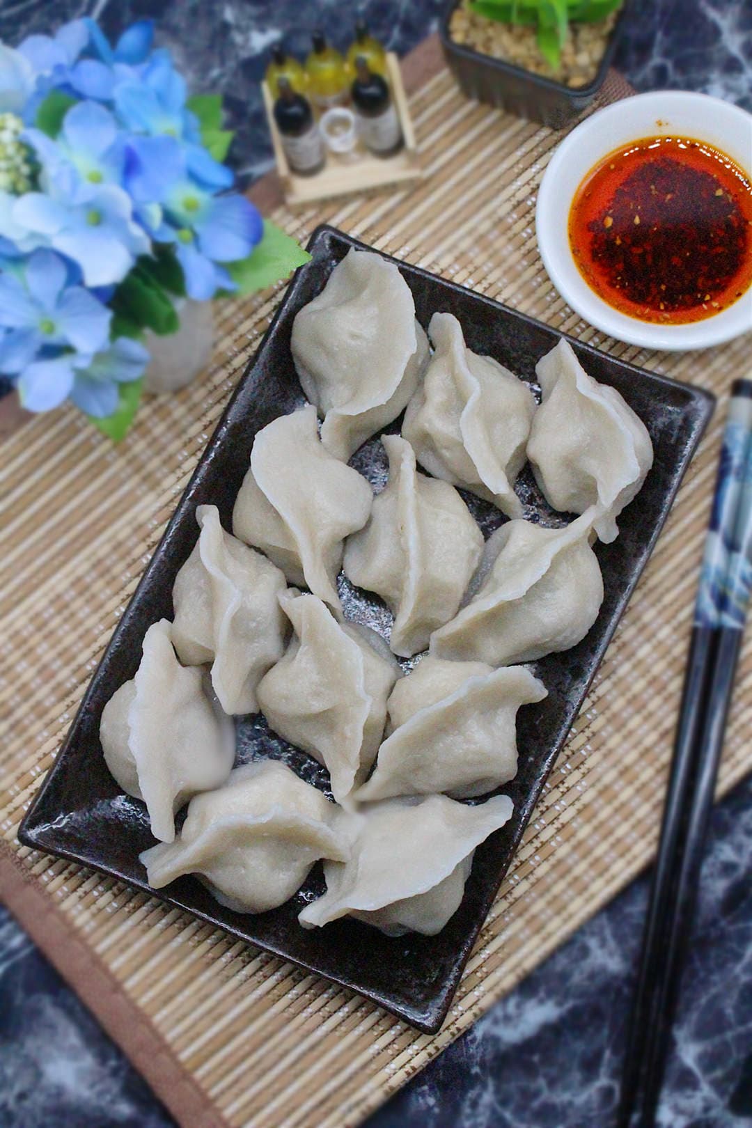 Lamb & Napa Cabbage Dumpling - Tender lamb dumplings complemented by the freshness of Napa cabbage, offering a  | Dumpling
