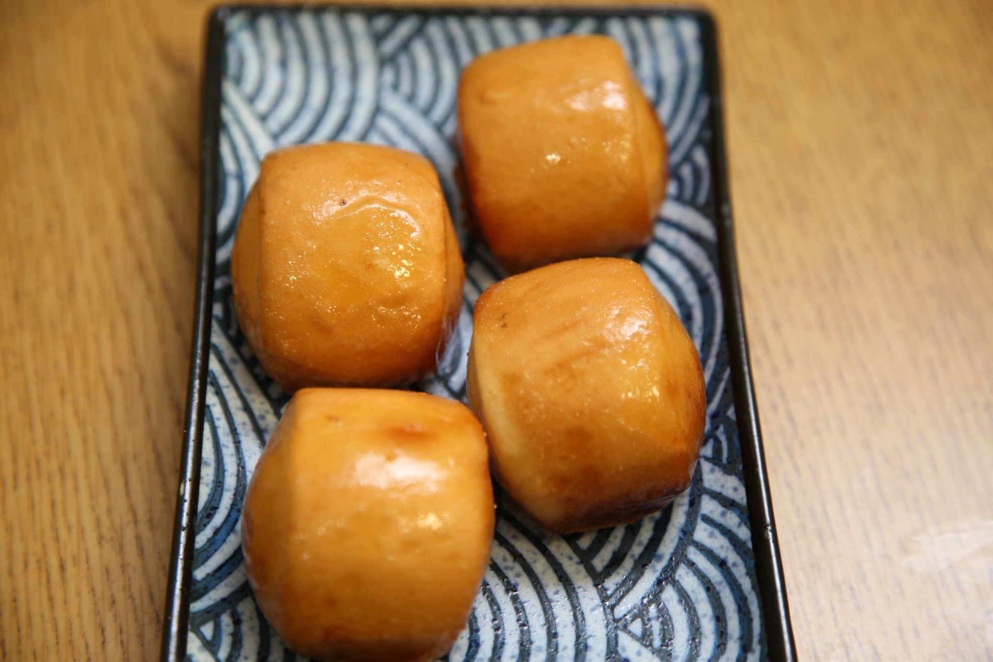 Golden Sweet Bun - Lightly fried to golden perfection, this crispy yet fluffy bun is served with a  | Dessert