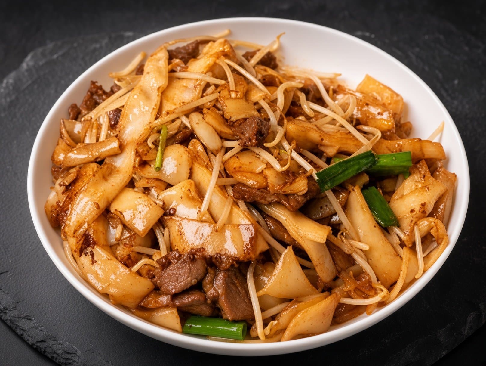 Beef Chow Fun - Wide rice noodles stir-fried with tender beef, bean sprouts, and soy sauce, resu | Chow Mein