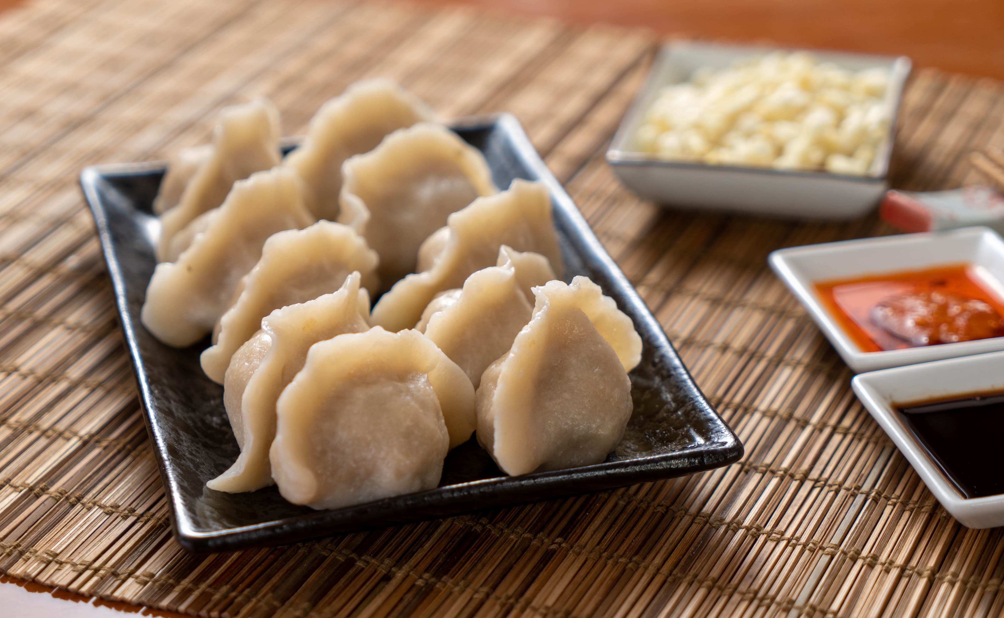 Pork & Dry Mushroom Dumpling - Juicy pork dumplings filled with savory dry mushrooms, providing a rich and eart | Dumpling