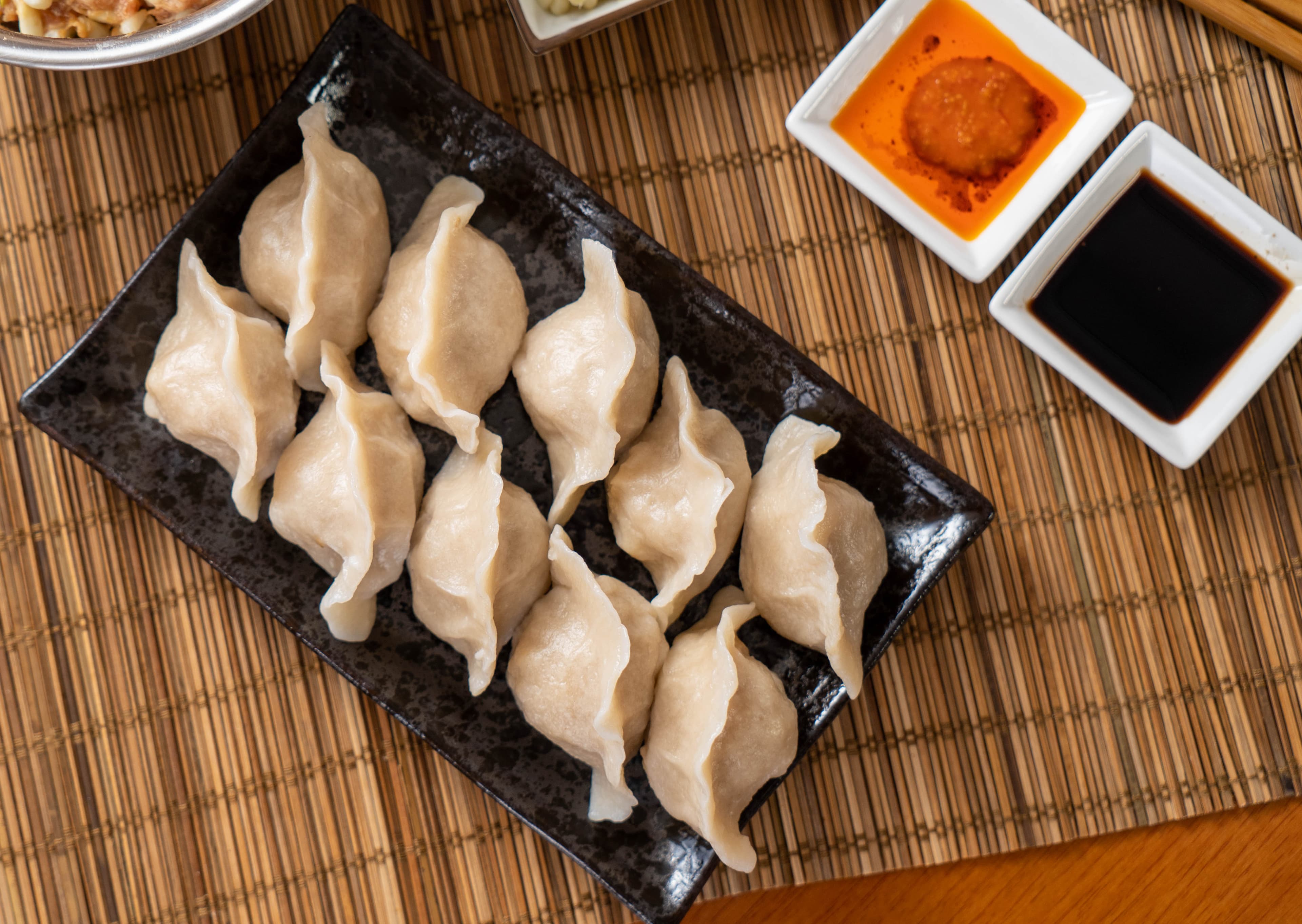 Pork, Shrimp & Chive Dumpling - A delectable combination of succulent pork, juicy shrimp, and aromatic chives, c | Dumpling
