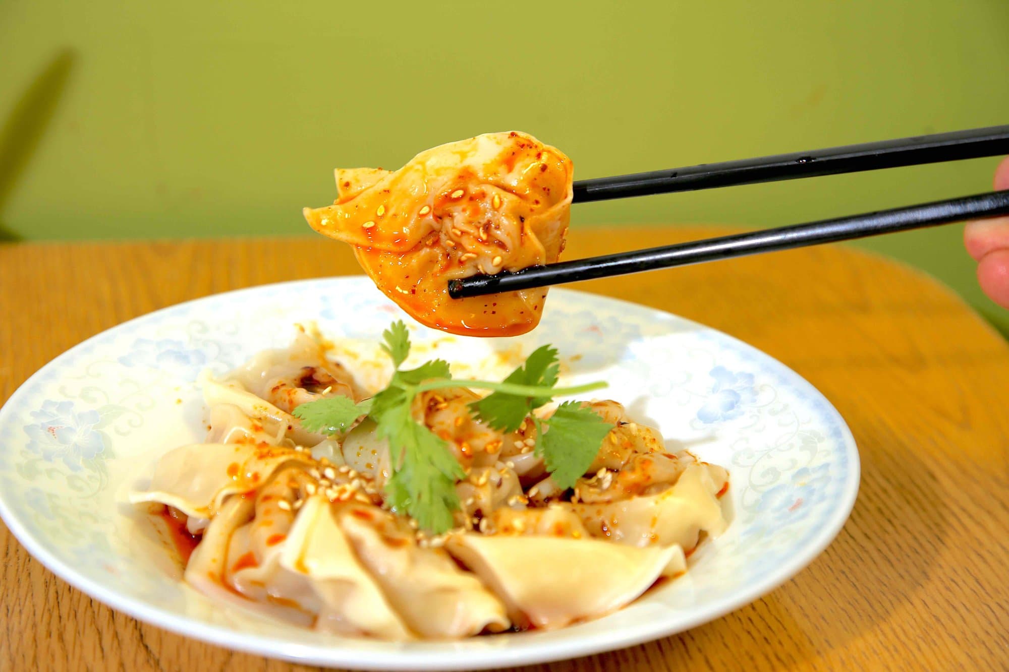 Szechuan Spicy Pork & Shrimp Wonton - Wontons filled with a pork and shrimp, served in a spicy Szechuan hot chili oil | Appetizer
