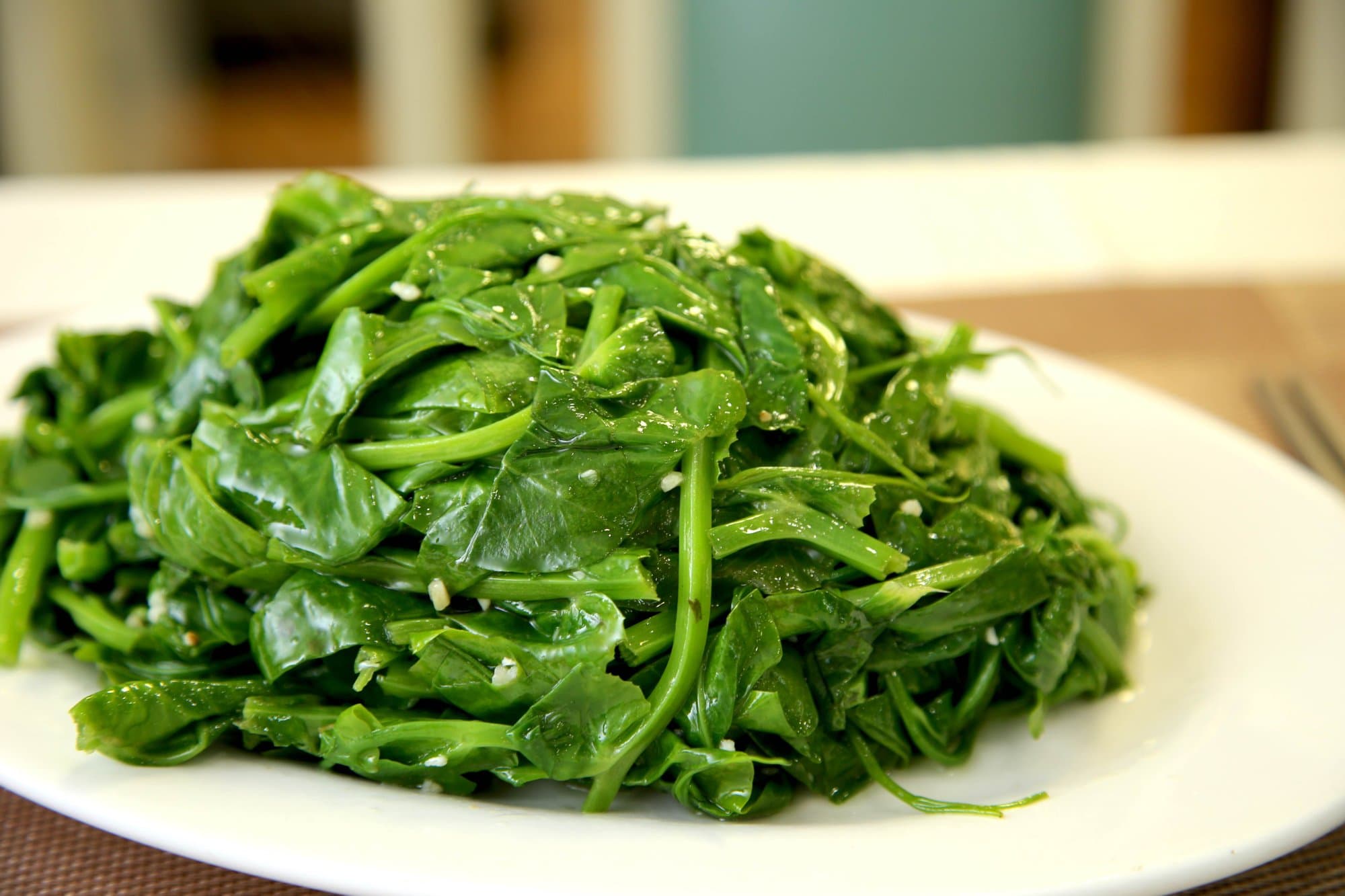 Sautéed Pea Shoots w/ Garlic - Tender and vibrant pea shoots stir-fried with garlic for a simple and delicious | Vegetable & Tofu