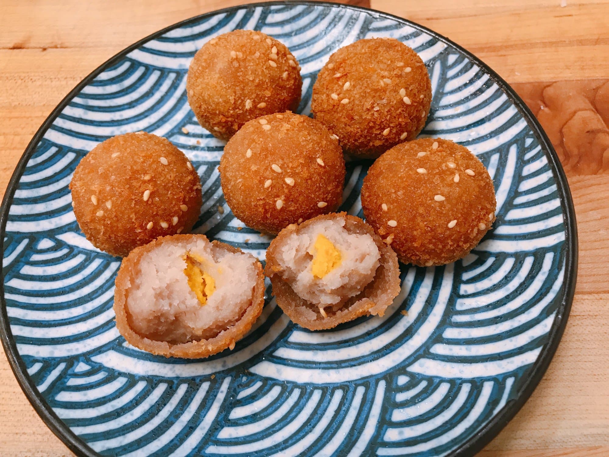 Golden Taro Ball - A crispy golden shell encases a smooth taro filling infused with egg yolk, offer | Dessert